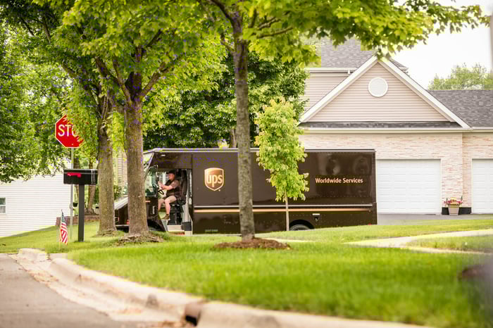 UPS delivery truck stopped on a residential street.