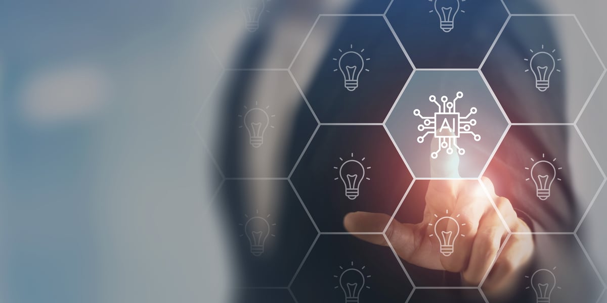 Person's left index finger pointing to AI chip drawing.