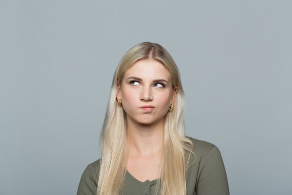 A person with a thinking look on their face.