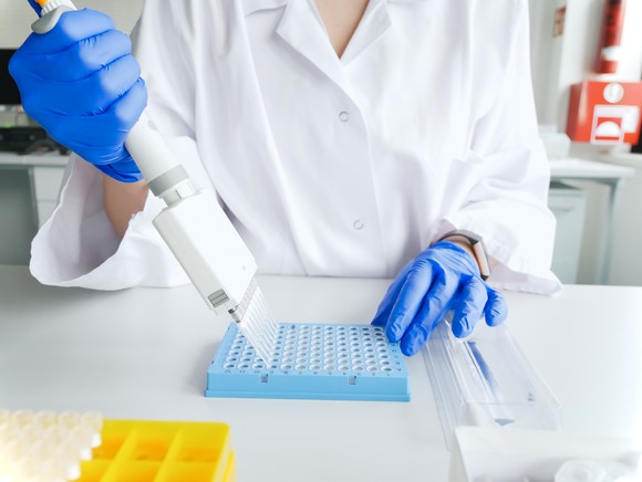 A lab technician running drug tests.
