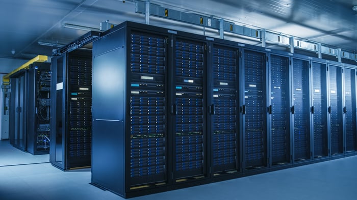 A data center with a stack of server racks.