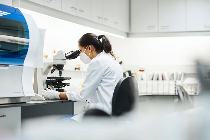 Scientist in a microscopy lab. 