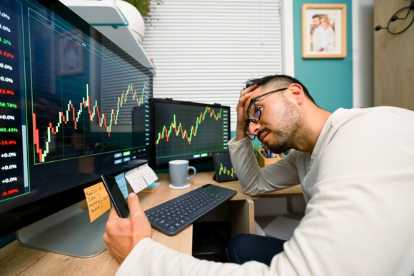 A trader reacts to market news. 