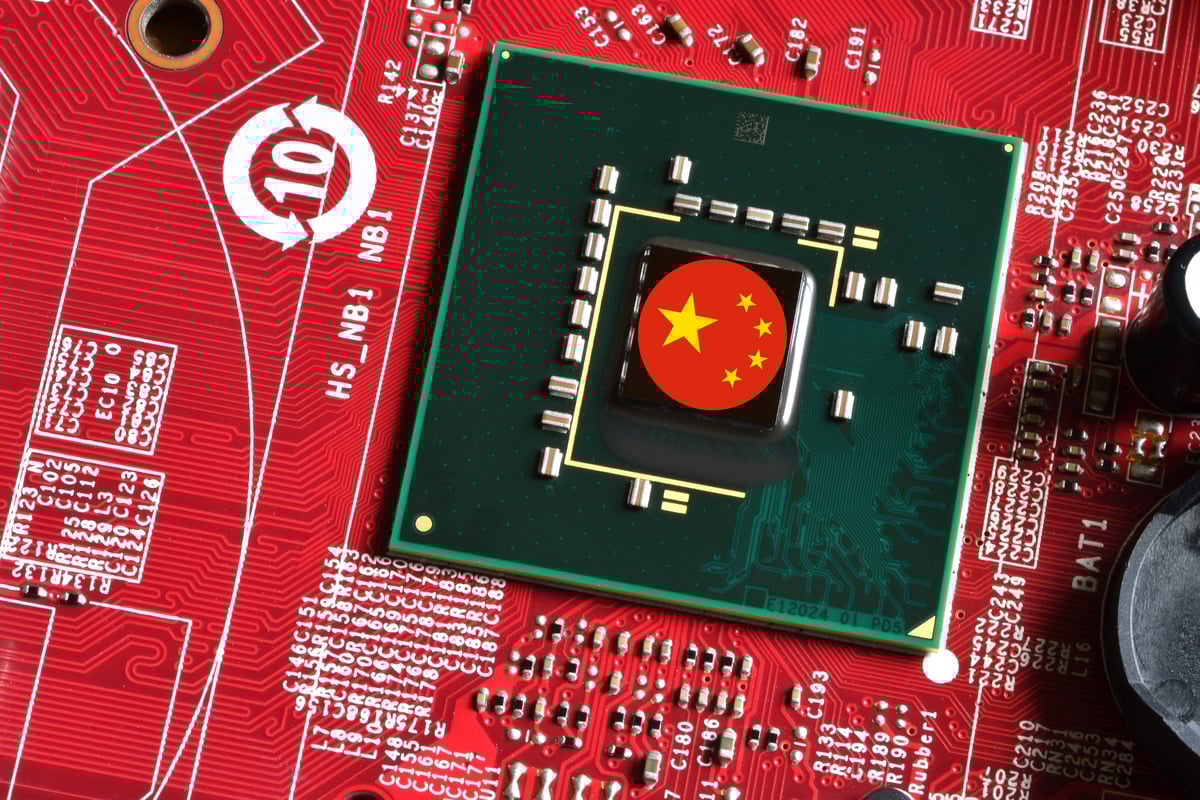 Tiny China flag on a red semiconductor chip.