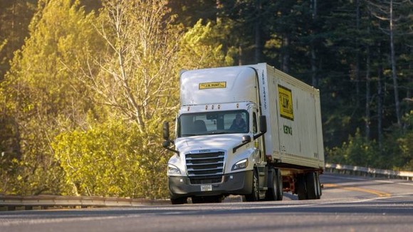 A J.B. Hunt truck rolls down a highway.