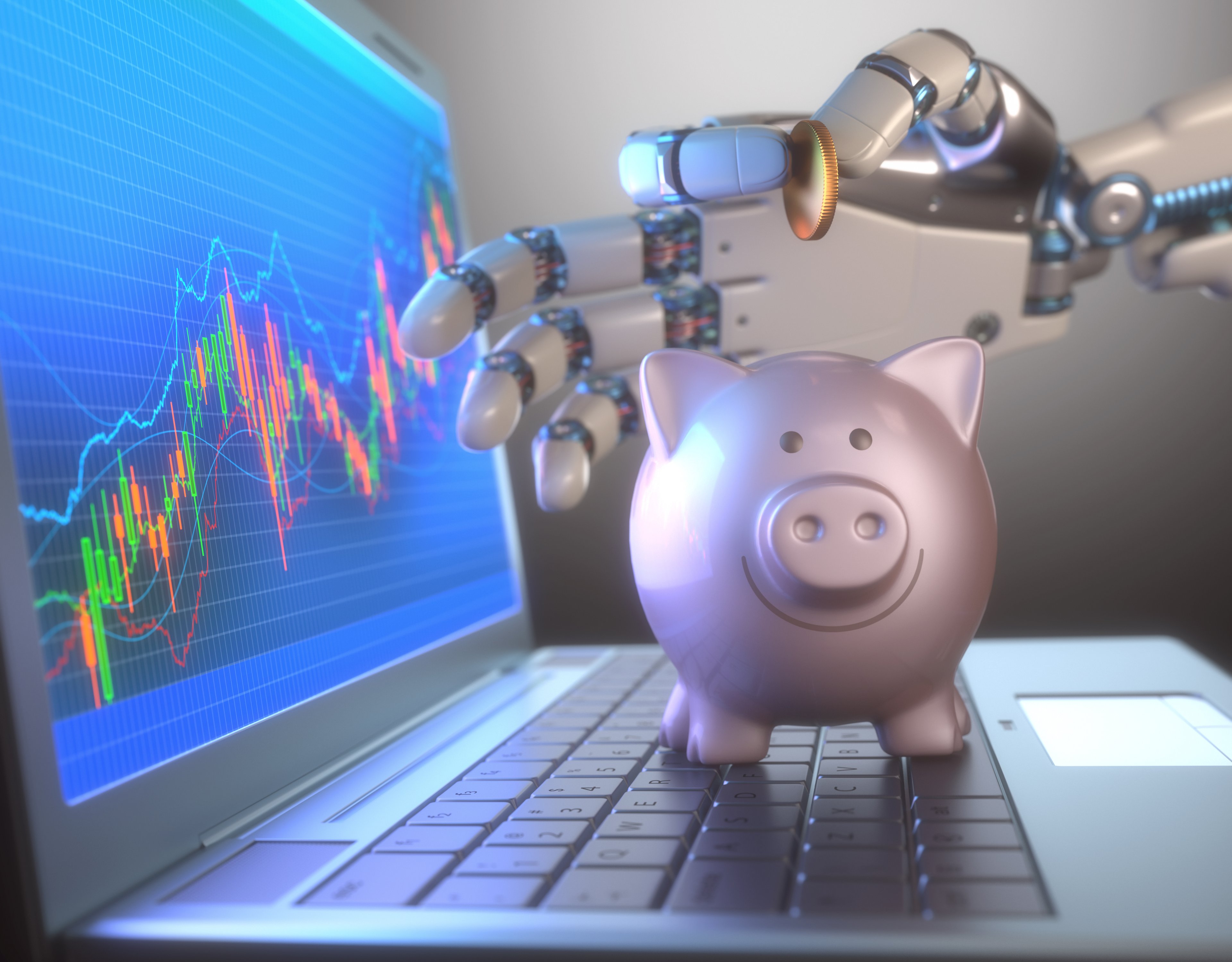 A robotic hand holds a coin above a piggy bank that is standing on the keyboard of a laptop.