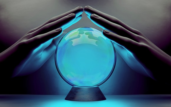 Hands on either side of a crystal ball.