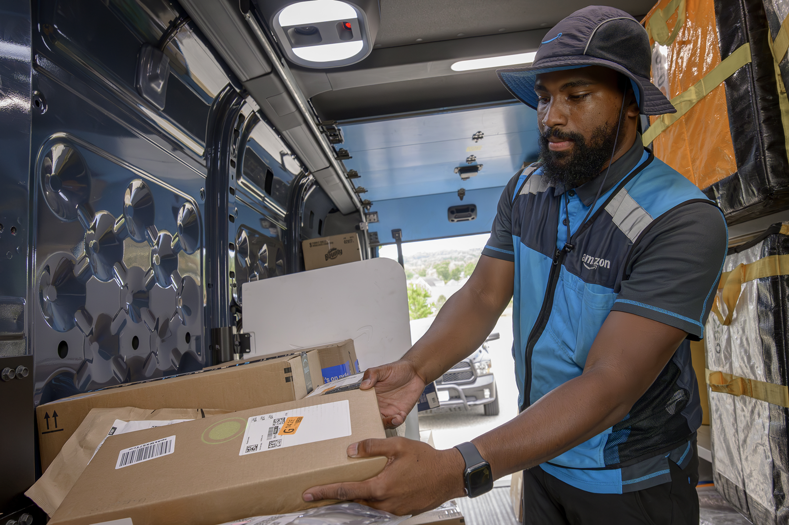 Amazon delivery person with a package.