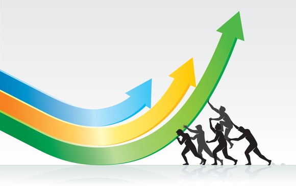 Silhouettes of people pushing downward arrows so they point upward.