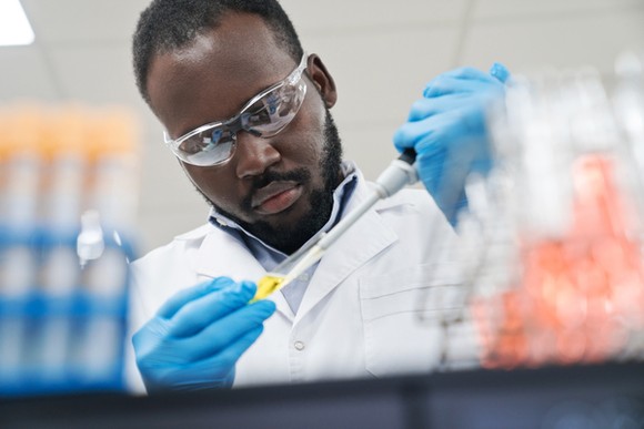 A scientist works in a lab.