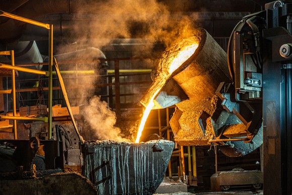 Molten metal being poured in a foundry.