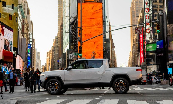 A Rivian truck in the middle of Times Square.