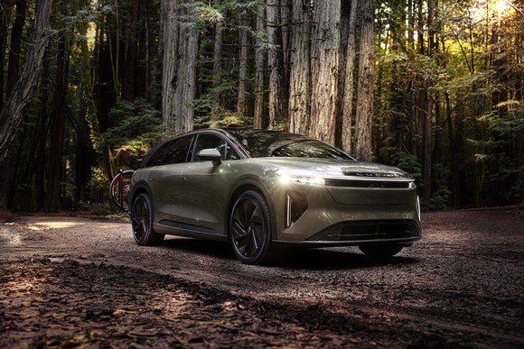 An SUV in the woods.