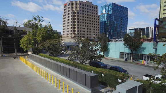 Street-level view of Bloom Energy's fuel cell technology in front of office buildings. 