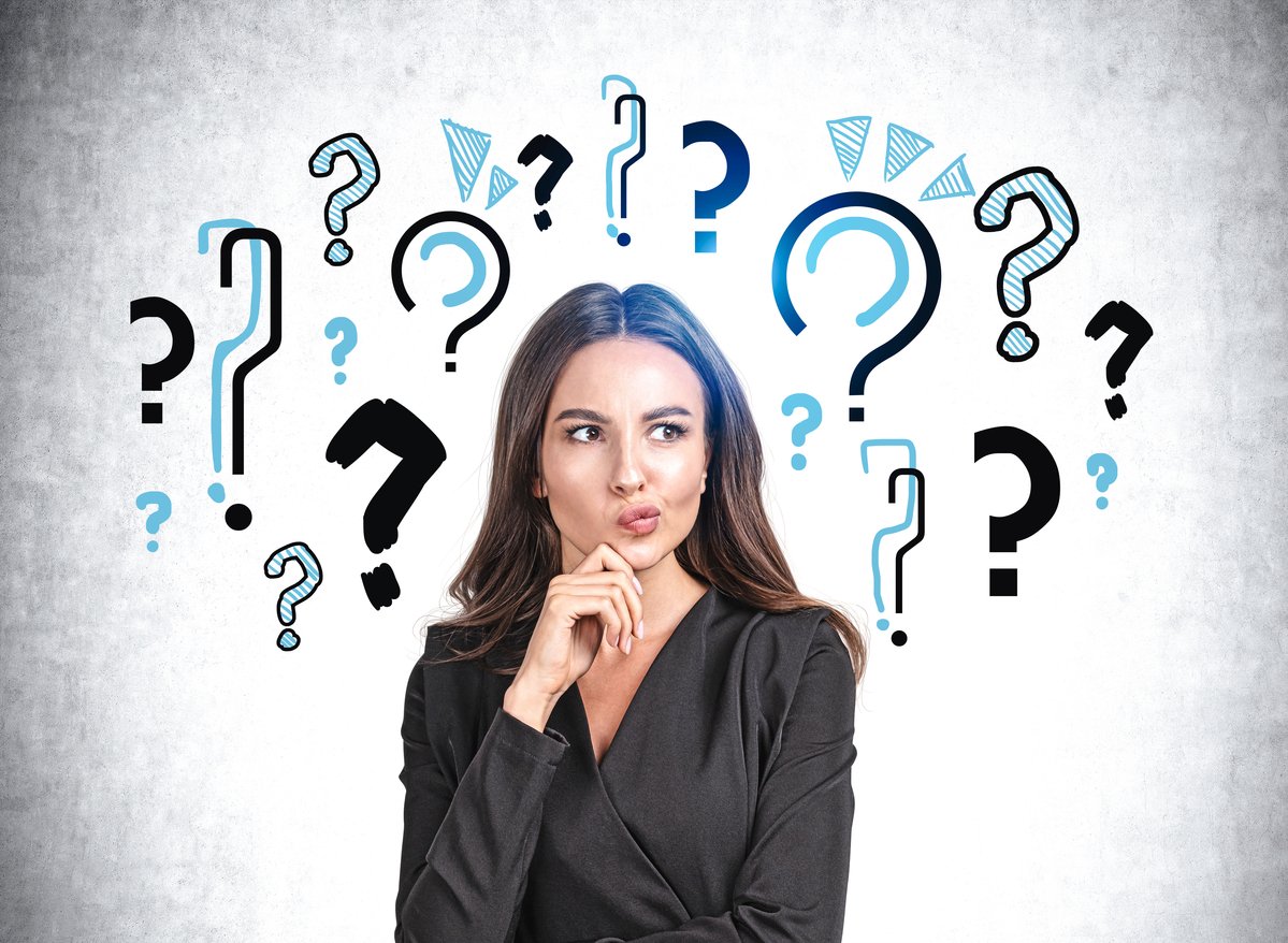 question marks surround a woman's head.