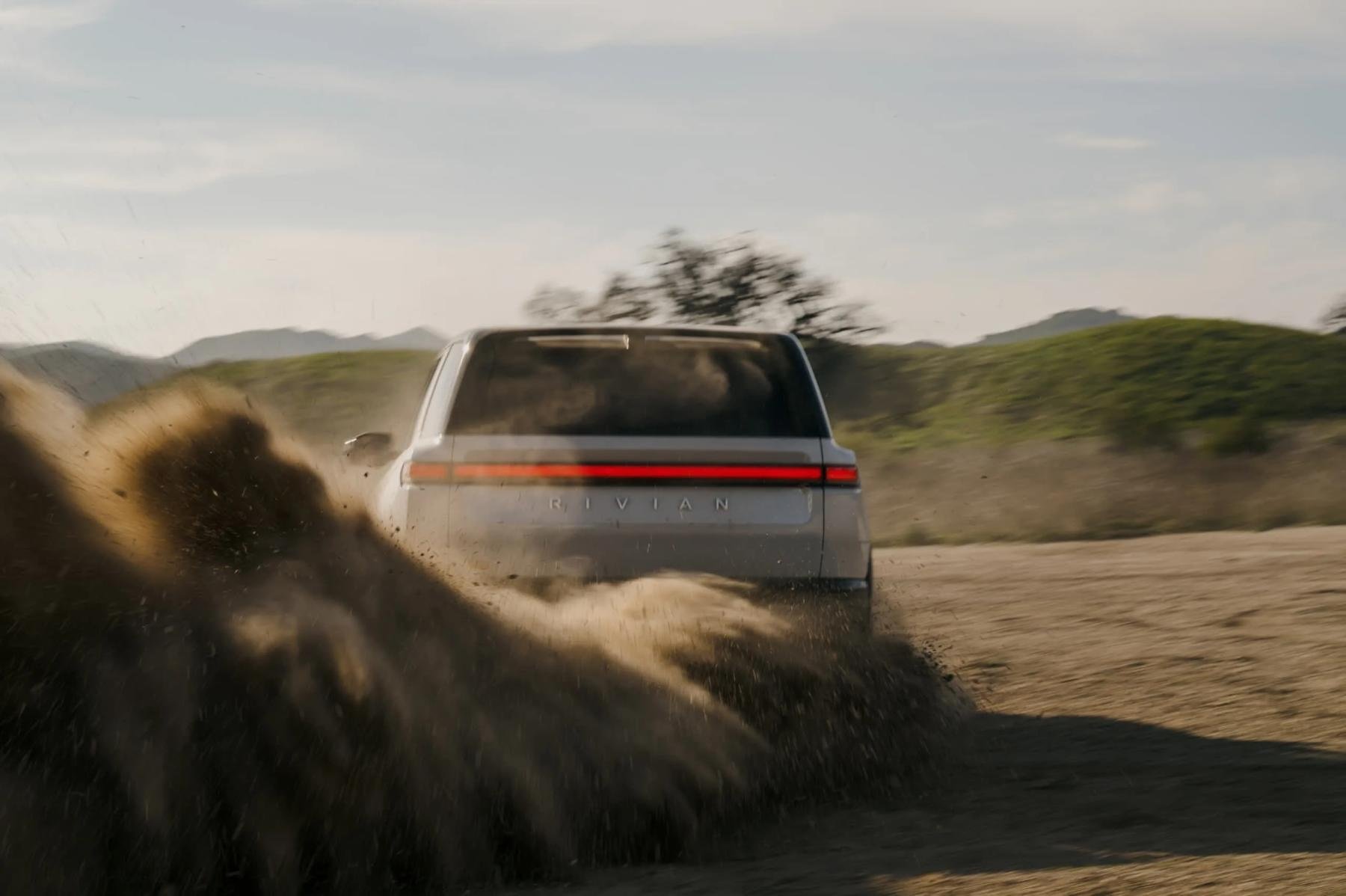 Rivian R2 rear view on dirt