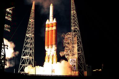 Delta IV Heavy rocket launch at night