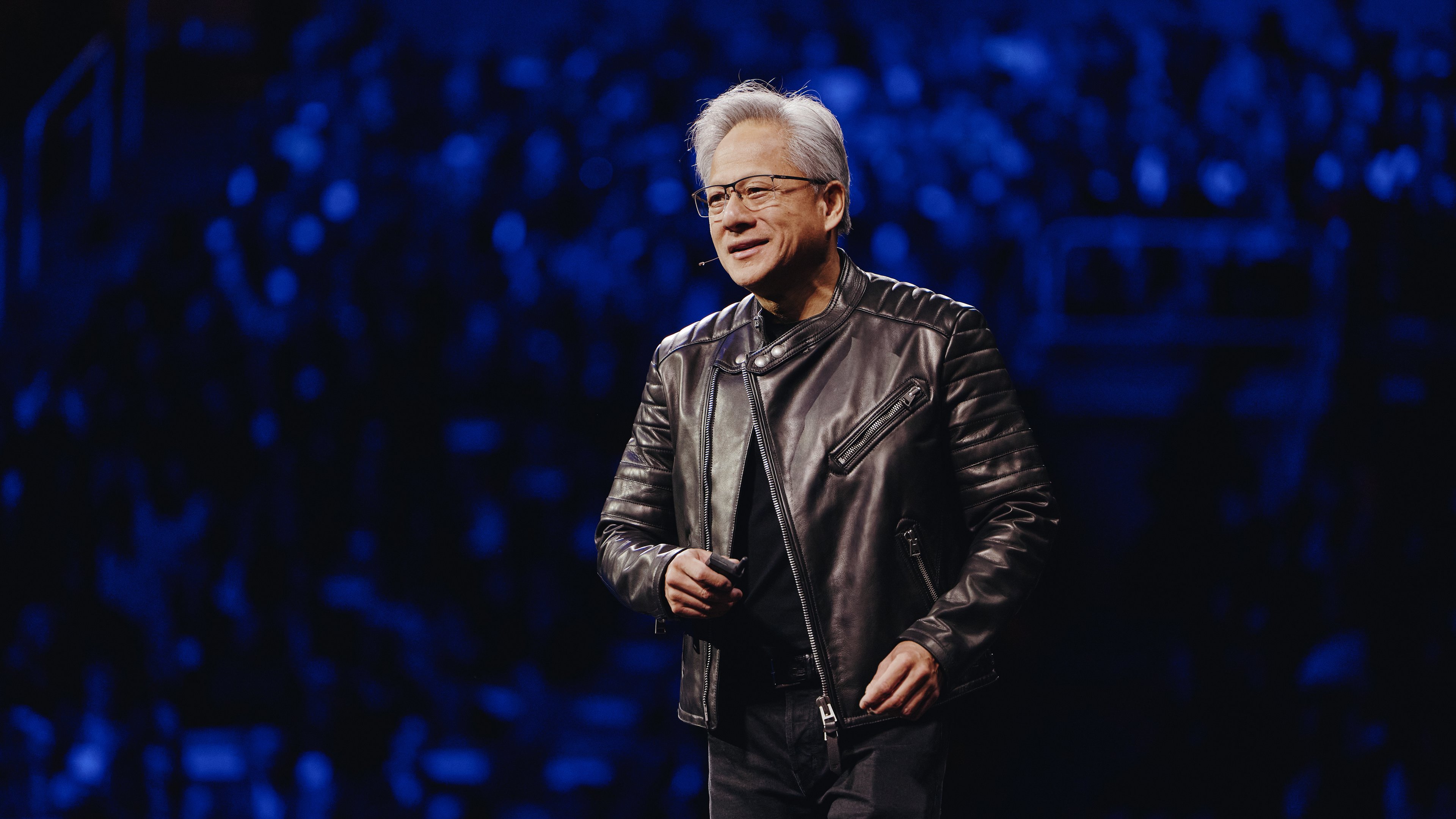 Jensen Huang on stage, delivering his keynote speech at Nvidia's GPU Technology Conference.