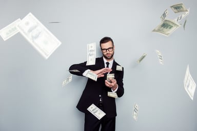 investor in suit throwing cash in the air.