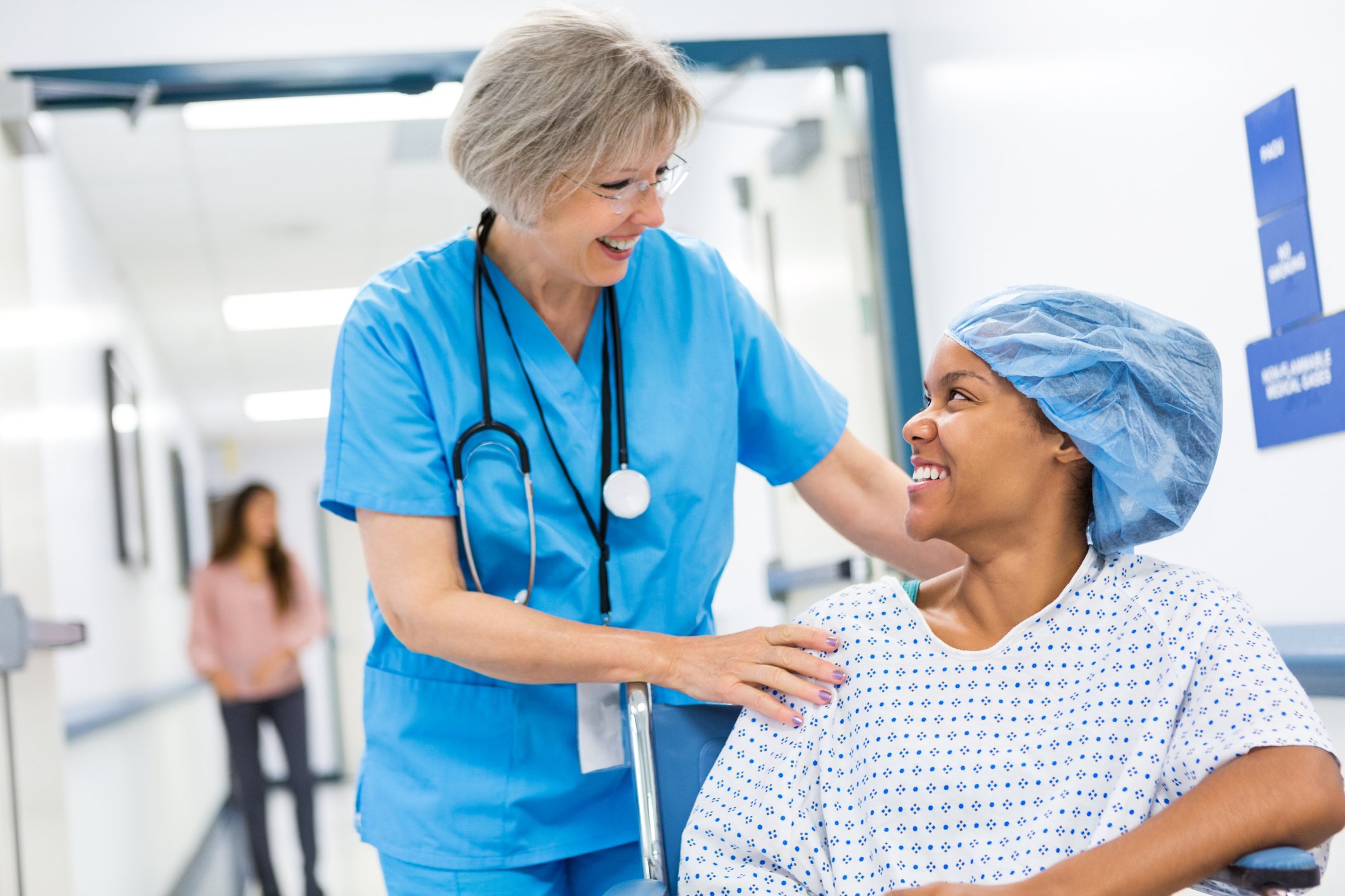 A nurse prepares a patient for surgery.