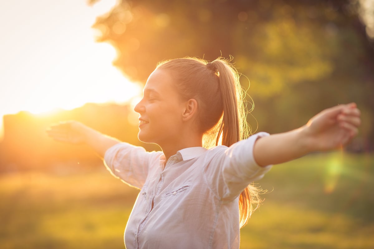 A person with outstretched arms. 