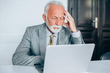 older man biz suit laptop GettyImages-1186388803