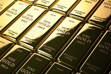 Stacks of gold bars marked FINE GOLD 1000g.