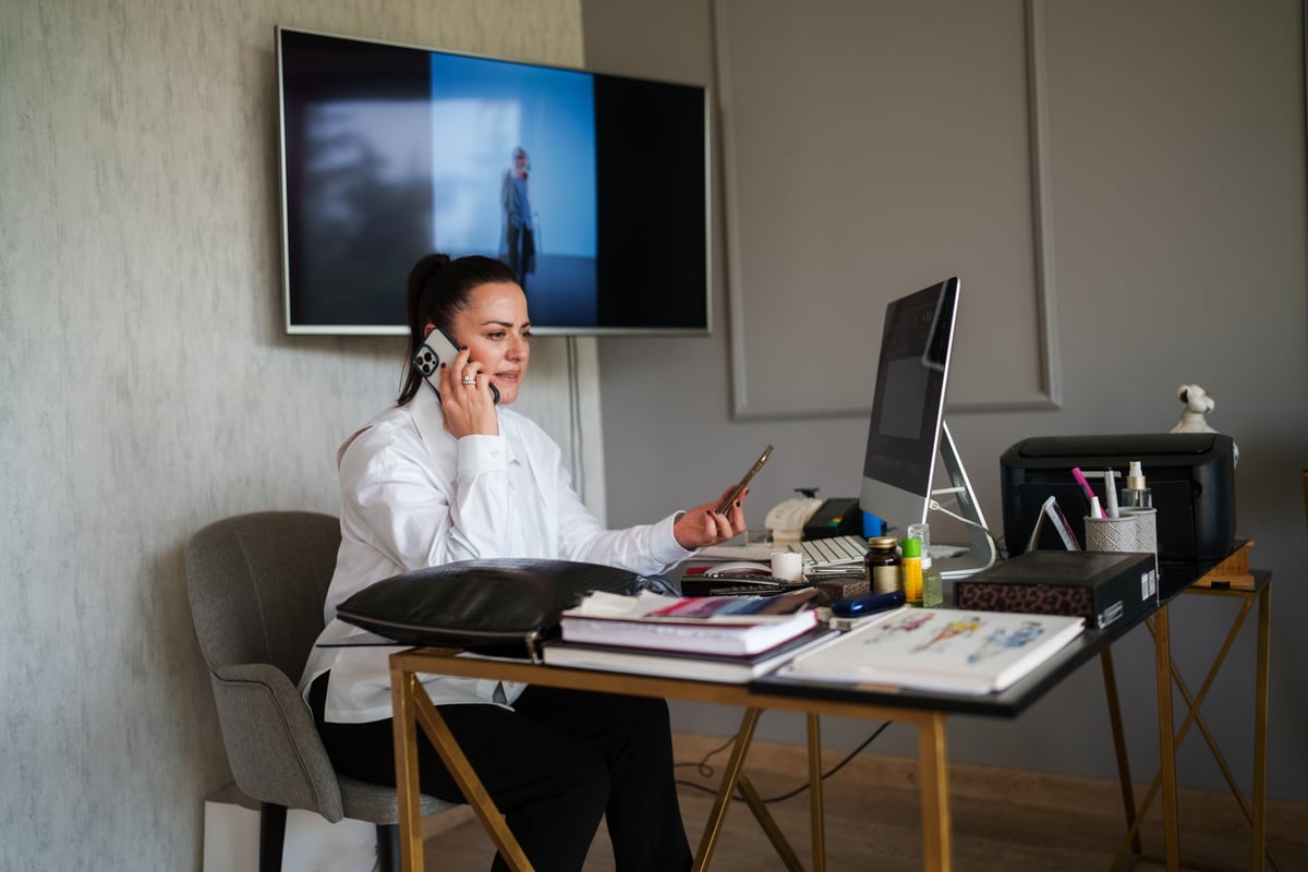 Professional_talking_on_a_smartphone_in_office