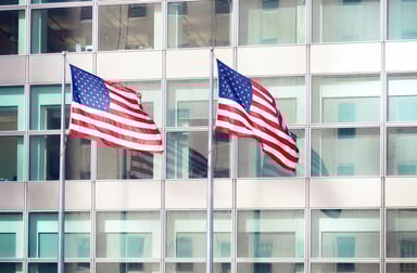 american flag in front of office building