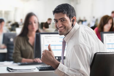 Business person giving a thumbs up.