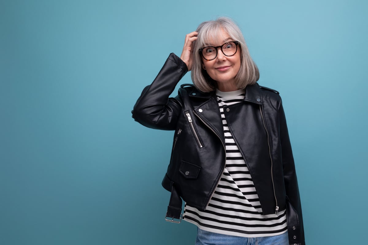 confused woman scratches her head.