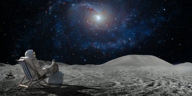 Person in astronaut suit sittin on the moon Getty