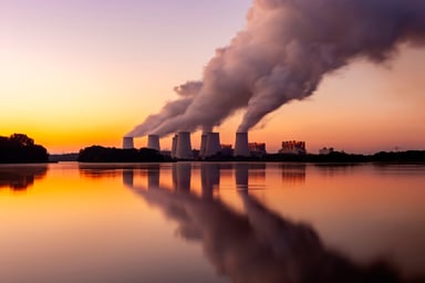 cooling towers of nuclear power plant at sunset.