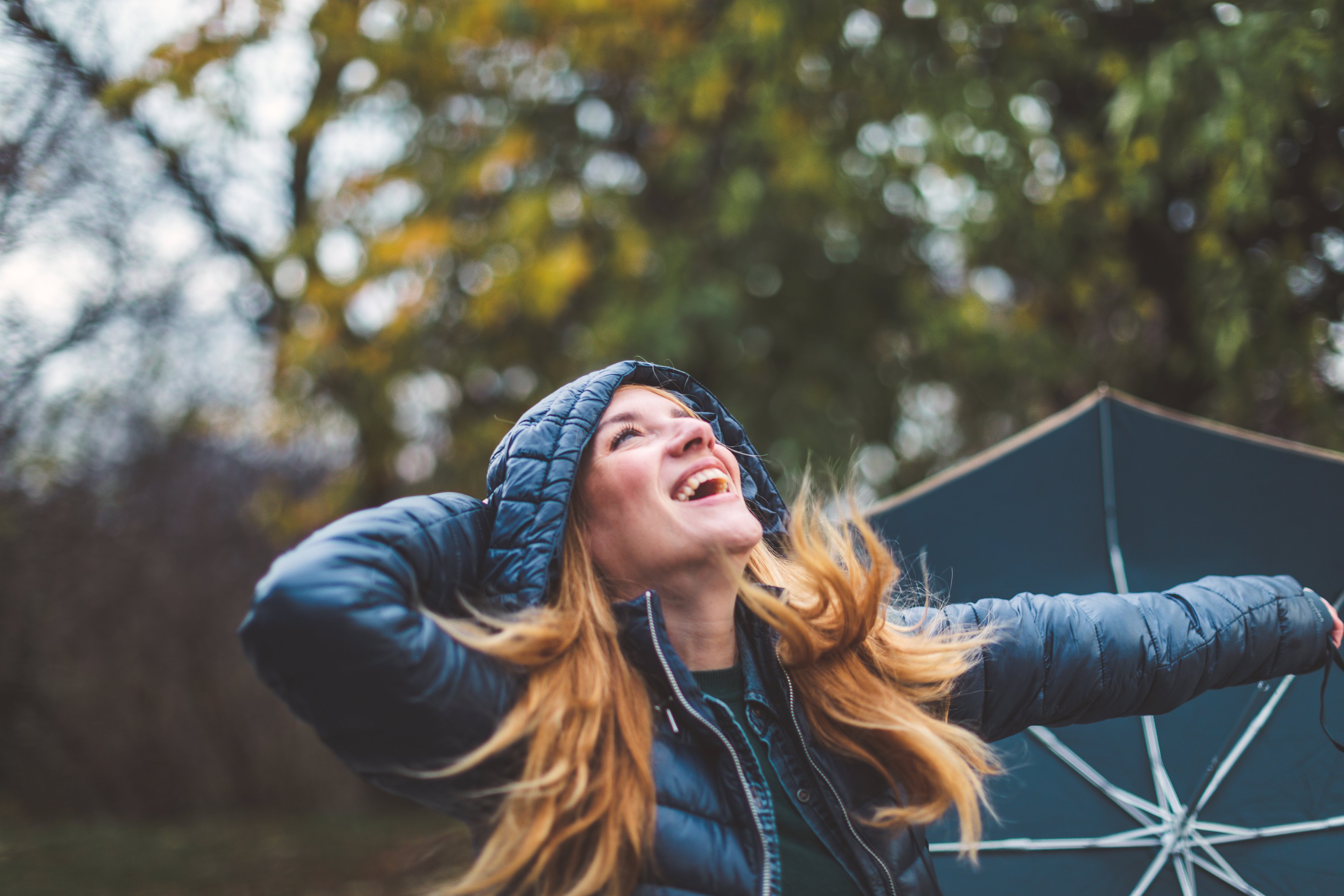 Getty - alarmed surprised person outdoors umbrella