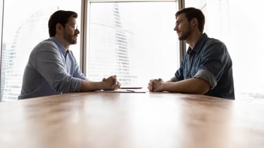 Two people sitting Getty