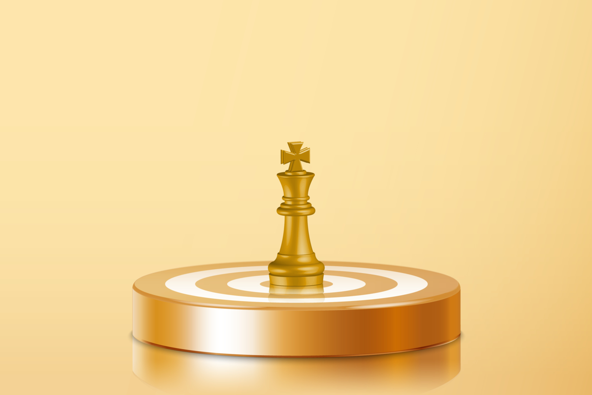 A king chess piece on top of a bullseye.