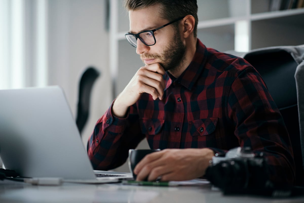 Professional_reading_intently_on_the_laptop