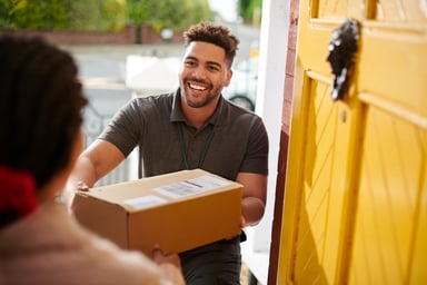 Person giving someone a box