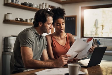 Couple Looking at financial papers.