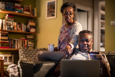 Couple looking at computer together
