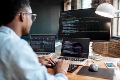 Image of a sofware engineer coding AI solutions