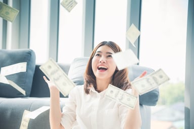 Person throwing money up in the air
