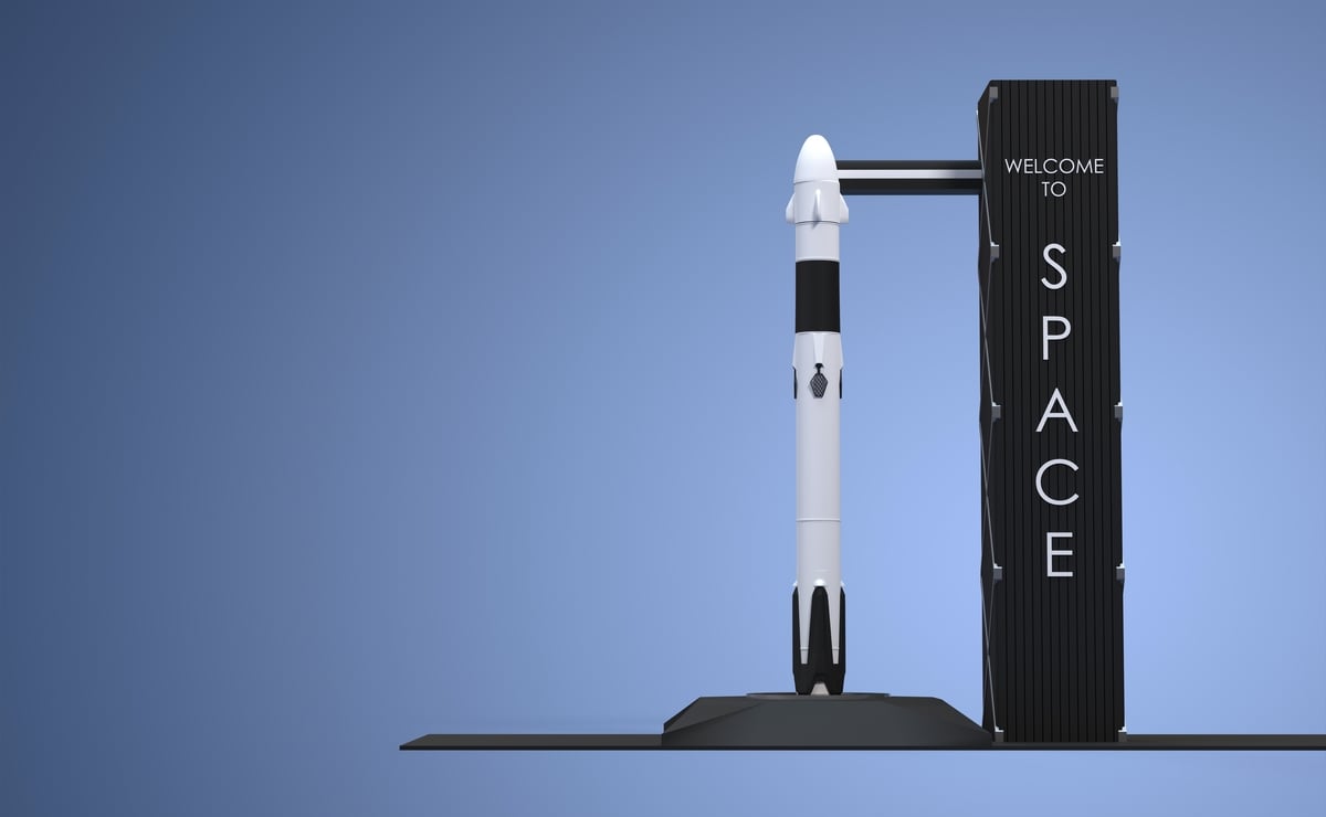 A toy rocket next to a launch tower that says welcome to space.