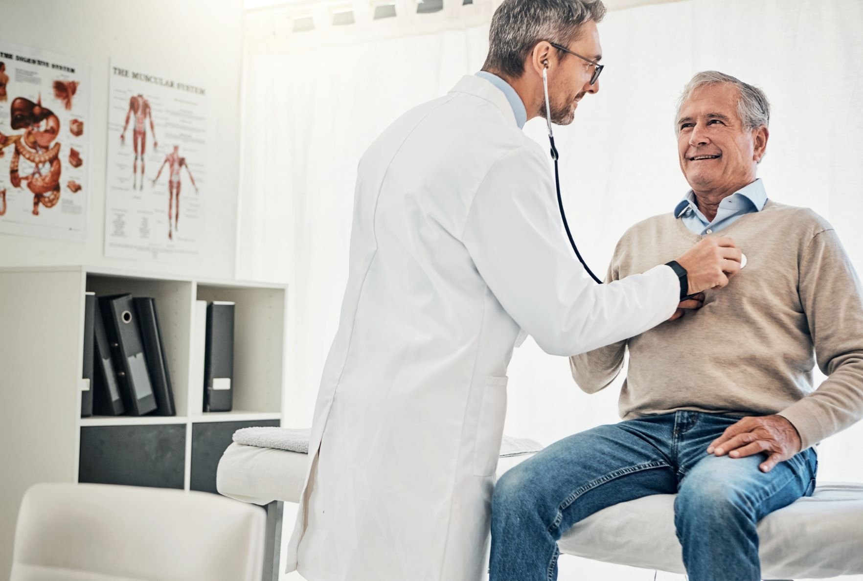 A doctor using a stethoscope.