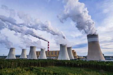 Nuclear power plant with seven cooling towers.