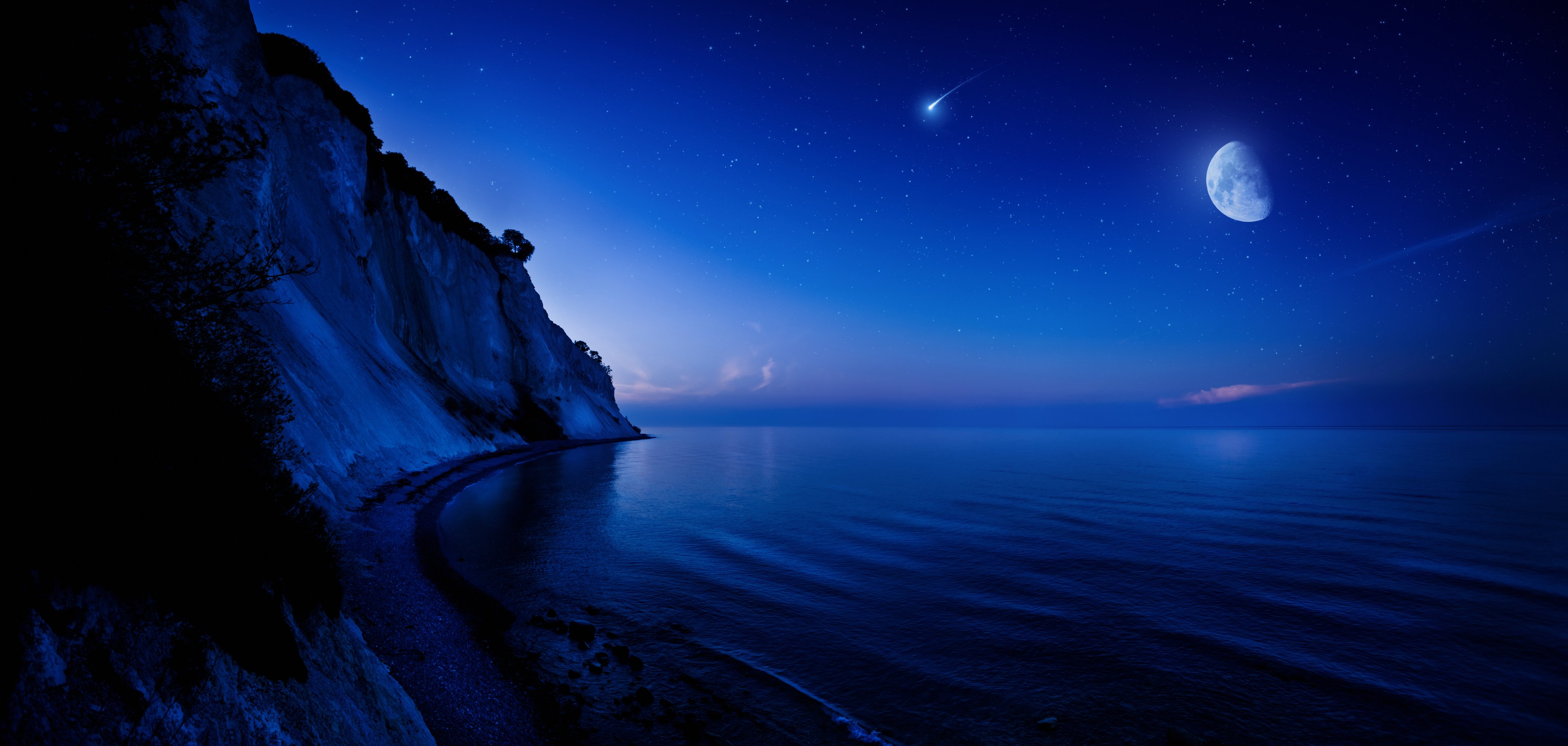 Night scene featuring the Moon in the background.