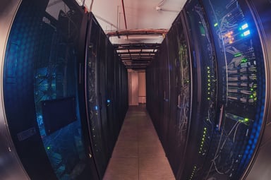Camera angle down row of data center servers