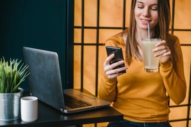 woman drinking lemonade on phone (1)