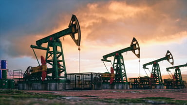 A set of oil rigs in a field