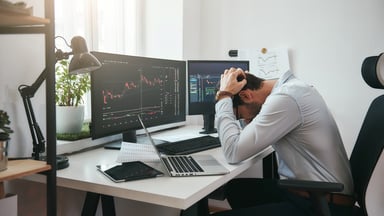 Frustrated investor looking at stocks.